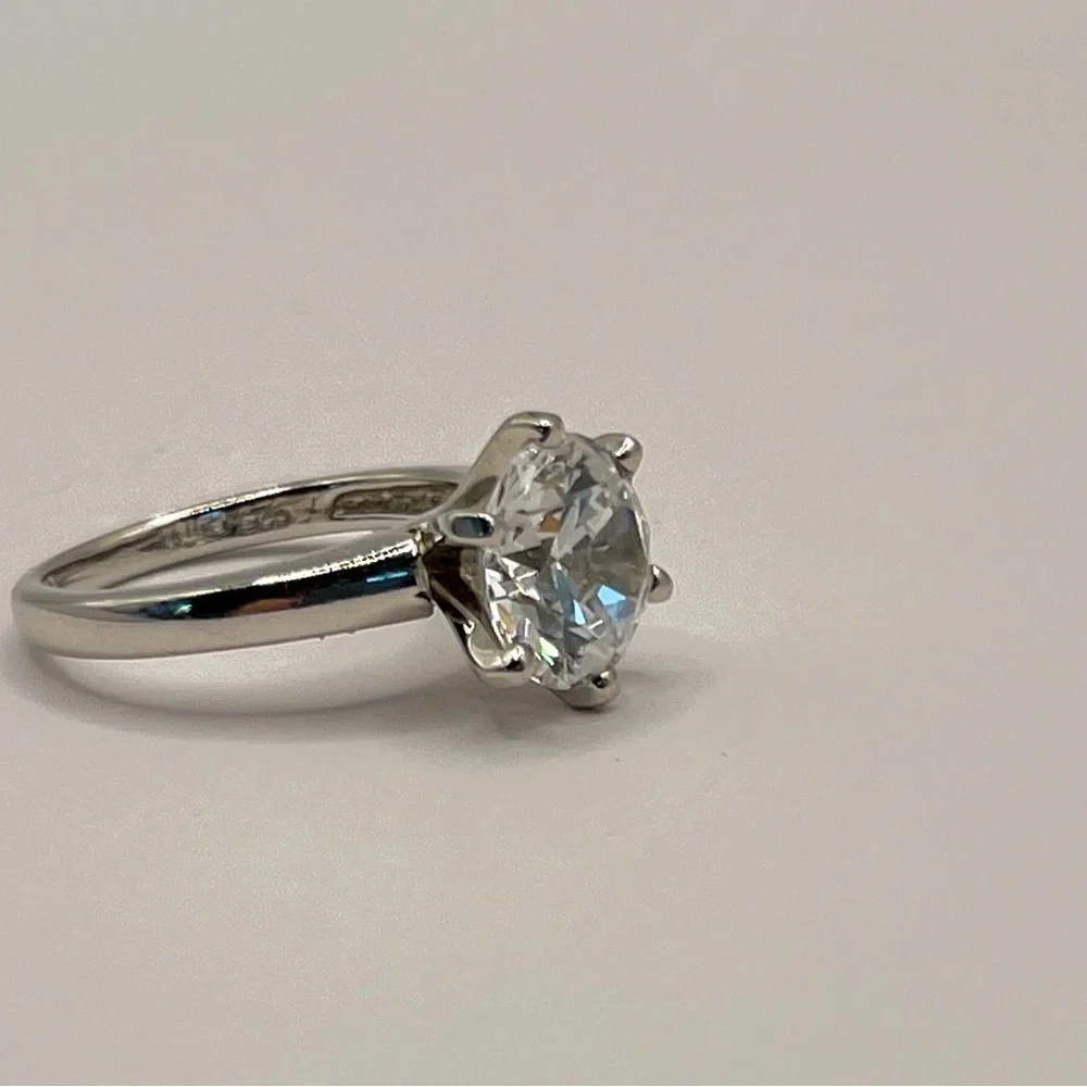 Two (2) carat cz solitaire in a 925 sterling silver setting. Size 6.25.